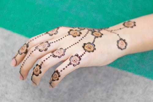 Free Floral Design Henna Skin Dye on a Woman's Hand Stock Photo