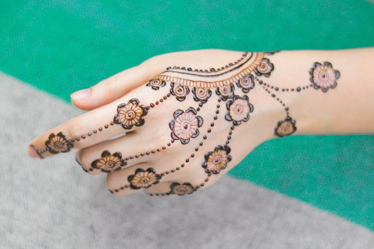 Traditional Floral Design Henna Tattoo On A Woman's Hand