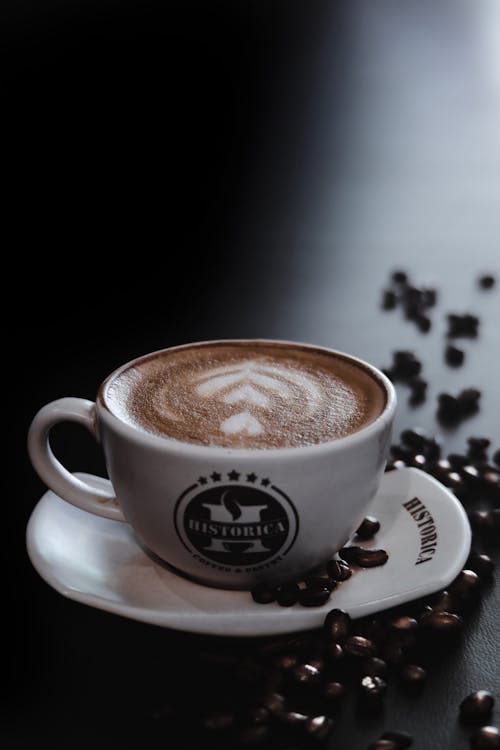 Free A Cup of Coffee with Latte Art in Close-up Shot Stock Photo