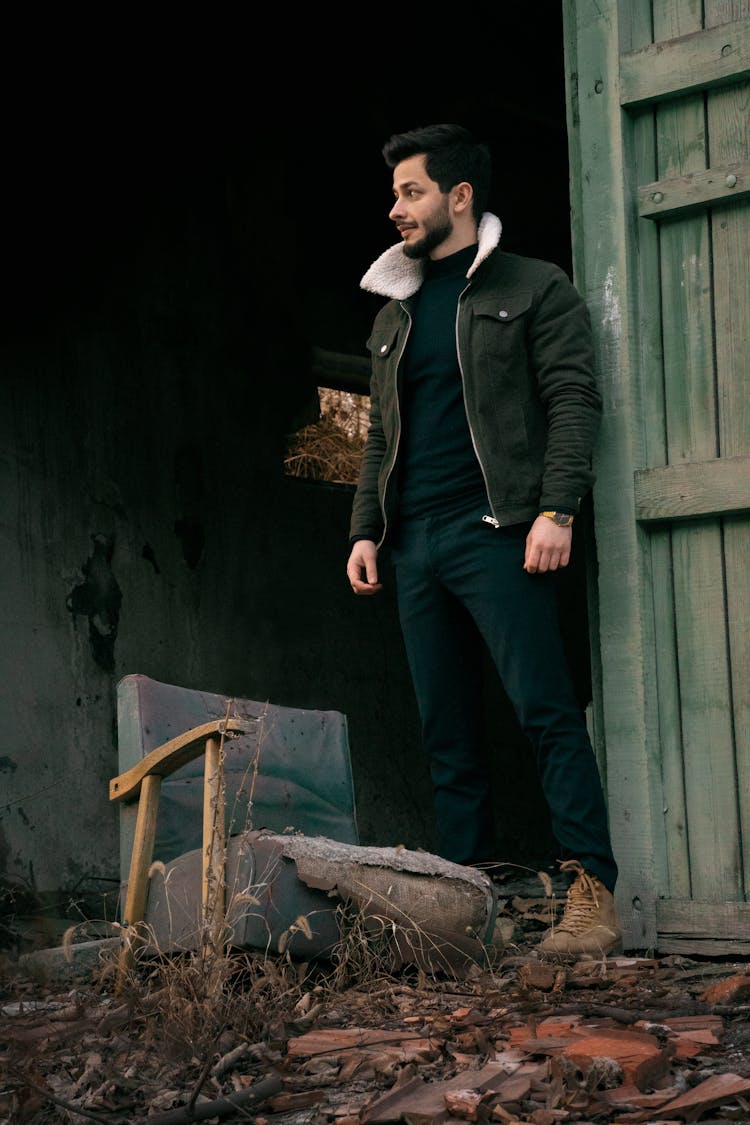 Man By Door And Broken Chair