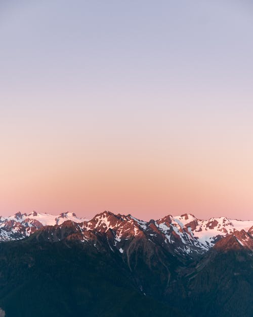 Free Snow Capped Mountains under Pink and Purple Sky Stock Photo