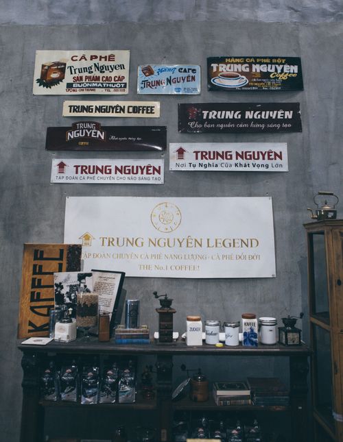 Free Interior view of a Trung Nguyen coffee shop, showcasing various signage and coffee-related items on display. Stock Photo