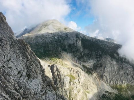 Breathtaking view of rocky mountains in Blagoevgrad, Bulgaria with clouds and blue sky.