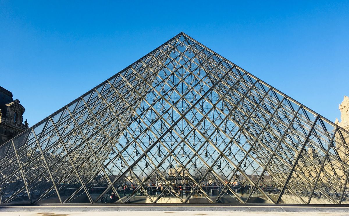 The Louvre's glass pyramid — book online and enter via Richelieu to skip the longest queue.