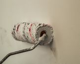 White and Red Textile on Stainless Steel Holder