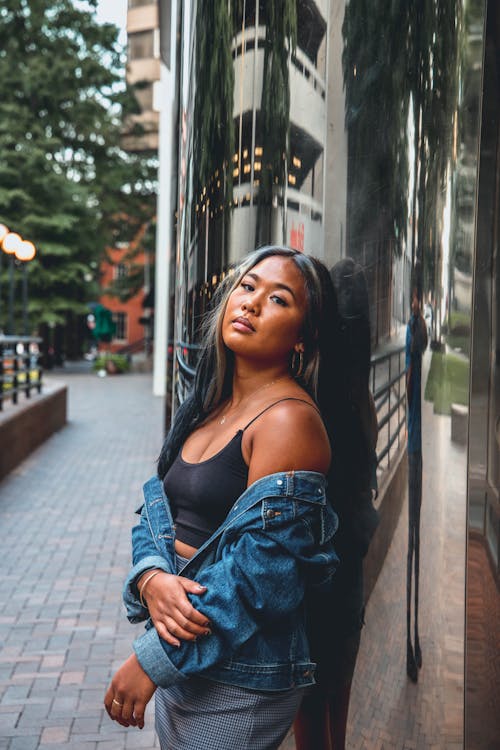 Woman in Jacket near Building