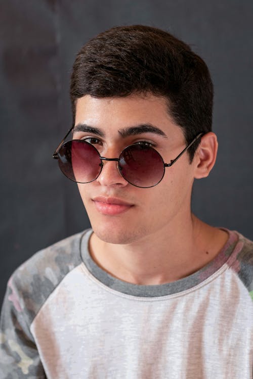A Man in a Crew Neck T-Shirt and Sunglasses