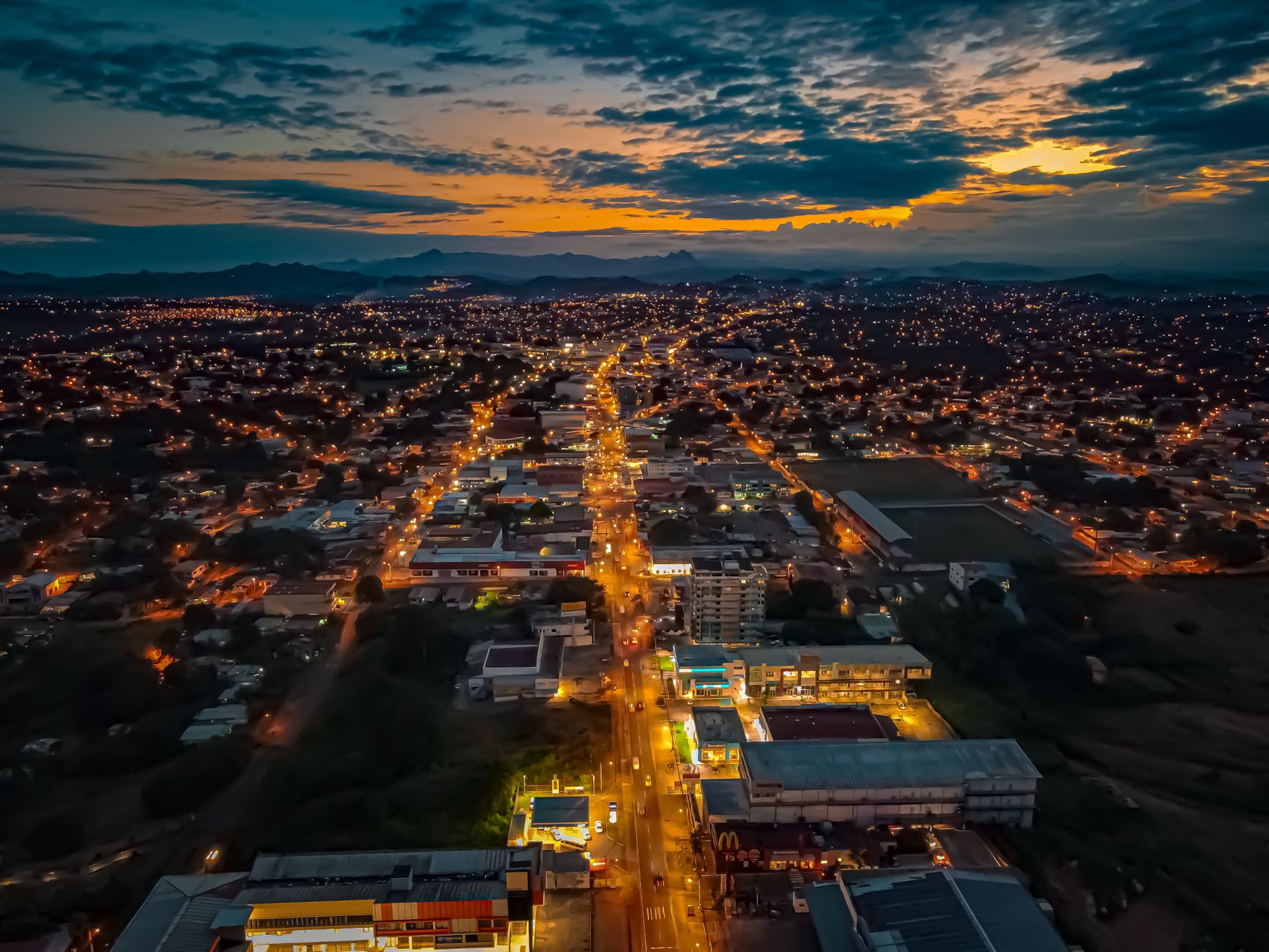 Mount Kenya visible above the rooftops of Nanyuki town at first light