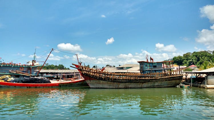 Photo Of Old Boats On Water