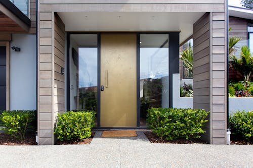 Green Plants Near Front Door of House