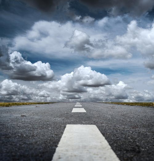 Gray Rolled Asphalt Road under Cloudy Sky 