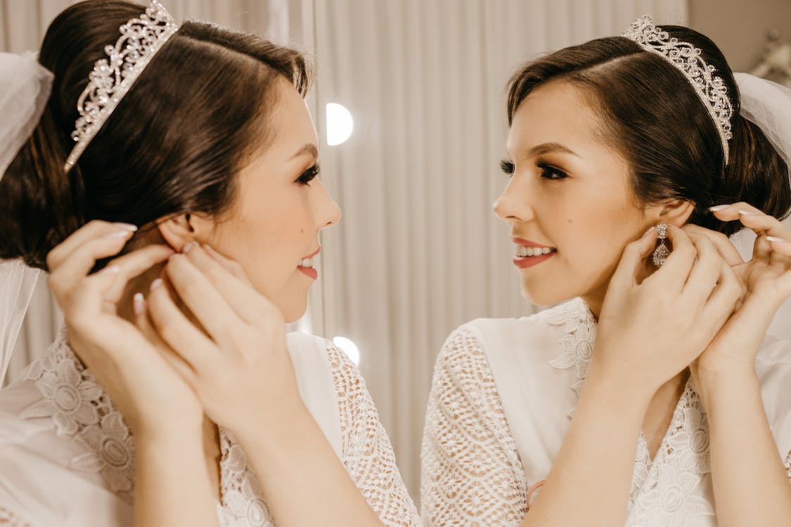 Free Happy bride reflecting in mirror Stock Photo