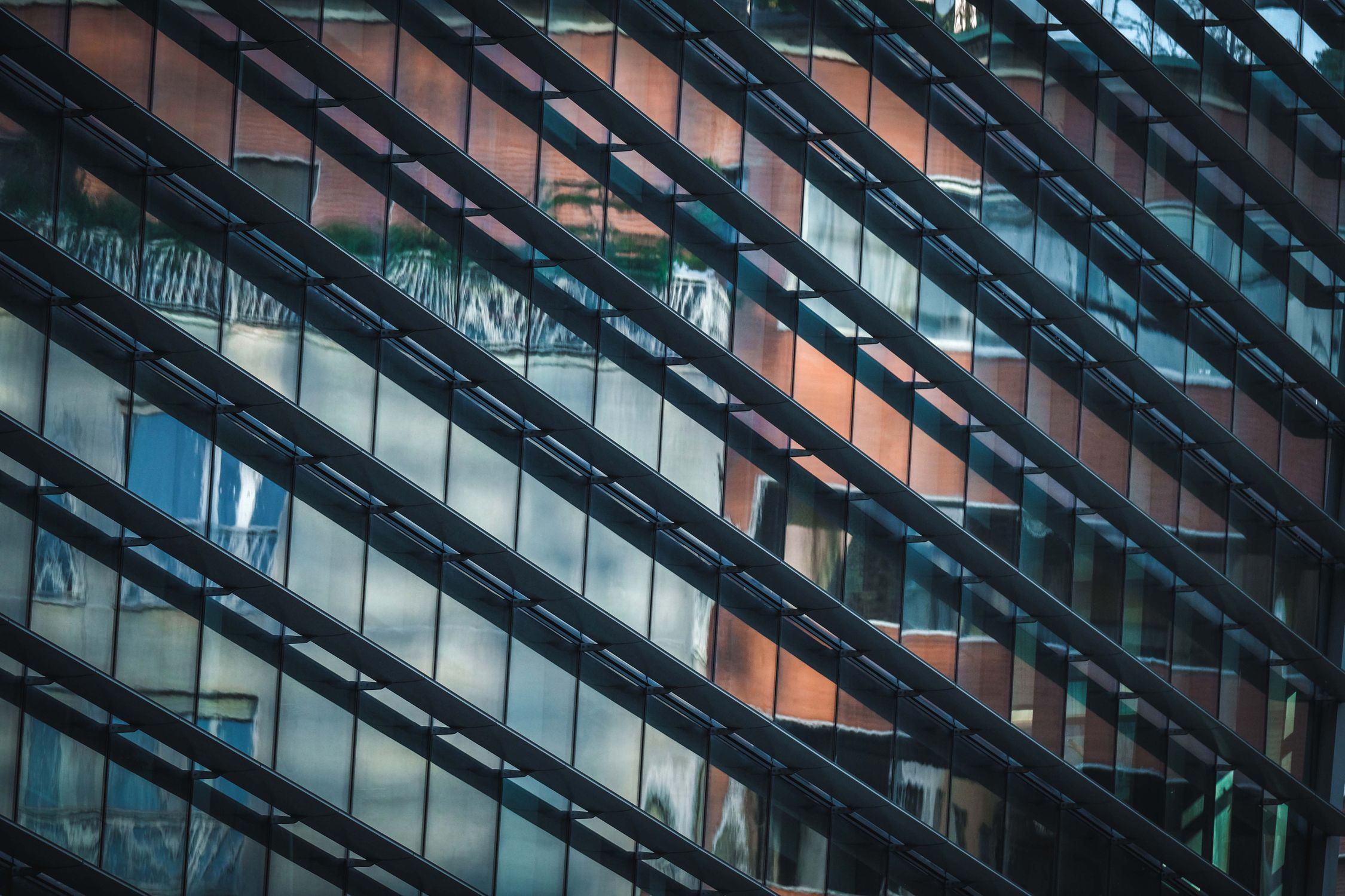 Exterior of futuristic building with mirrored geometric windows · Free ...