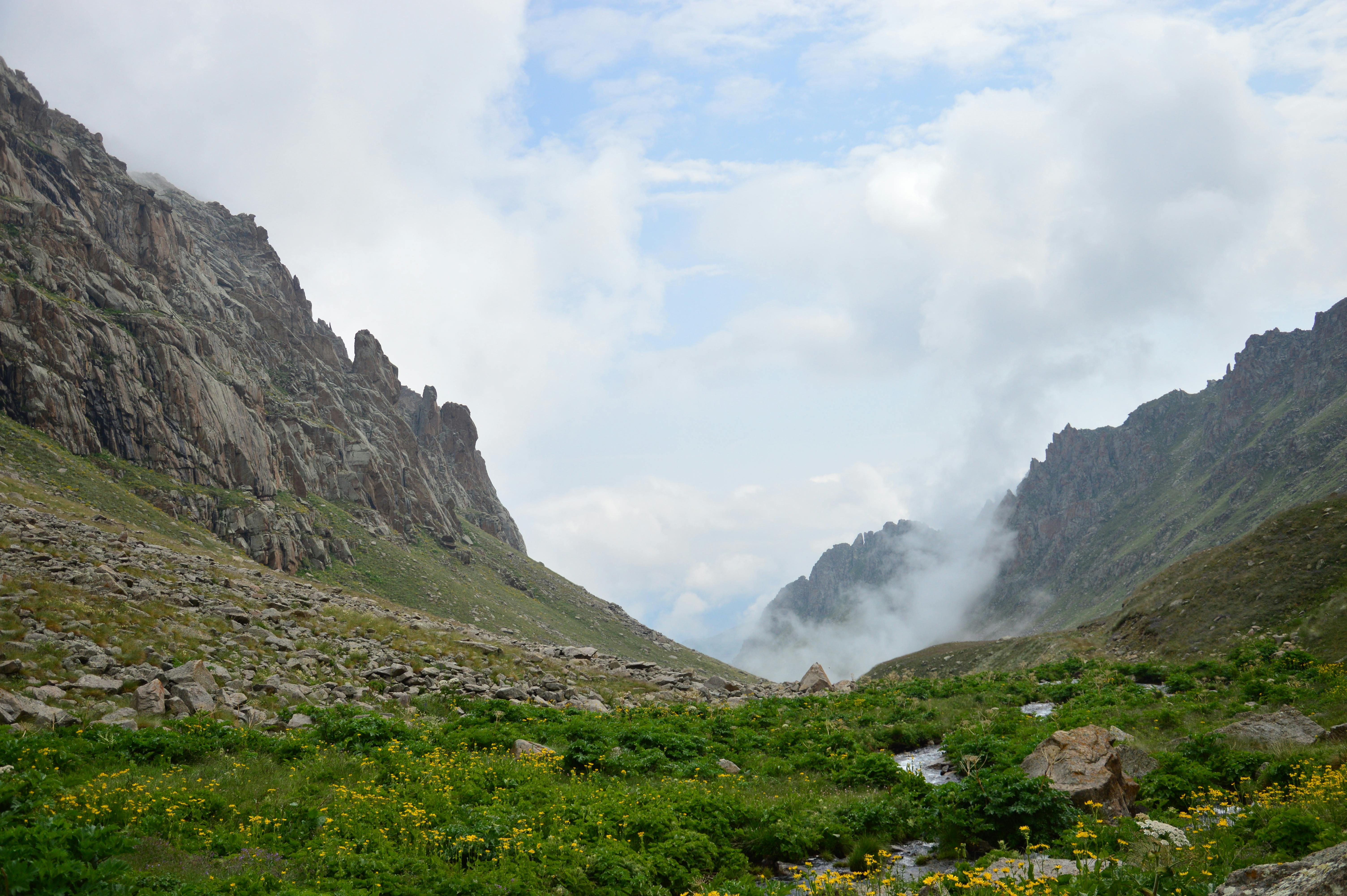 Rugged Kaçkar Mountain peaks with alpine meadows and traditional yayla settlements at golden hour, northeastern Turkey, Black Sea region wilderness
