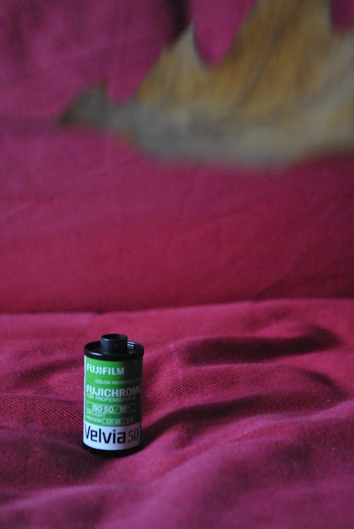 A Fujifilm Velvia 50 Film Cartridge on a Textile