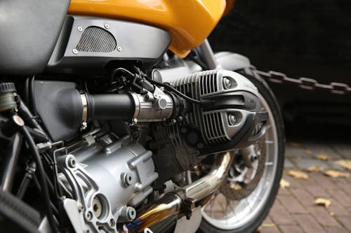 Free Yellow and Gray Motorcycle Parks Near Chain Rail Stock Photo