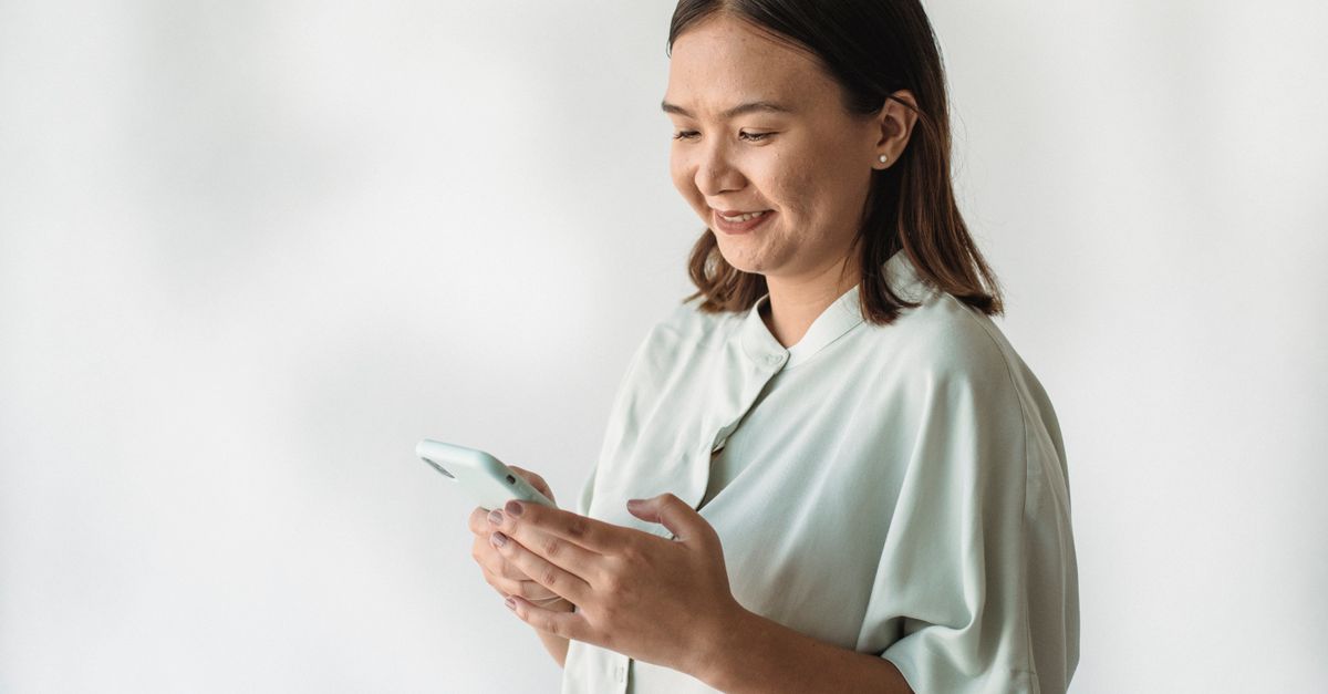 person turning off phone notifications with a relaxed expression