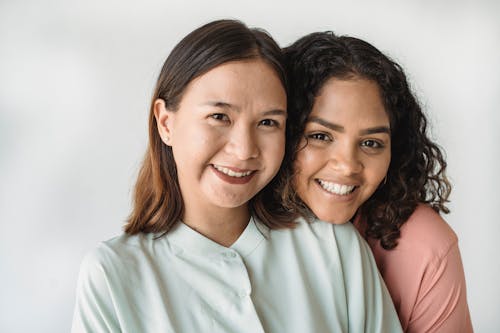 Free Portrait of Two Women in Blouses Stock Photo