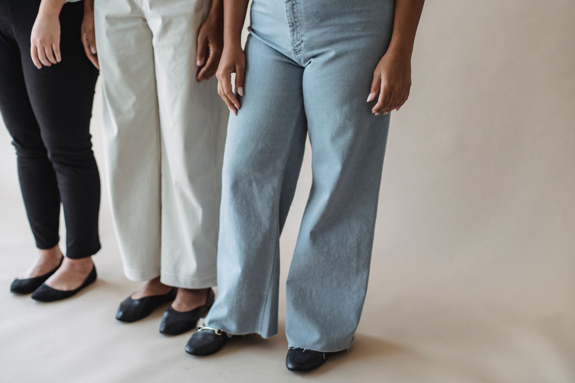 comparison showing wide-leg crepe trousers looking too casual versus slim ponte trousers reading as formal SOURCE: Pexels