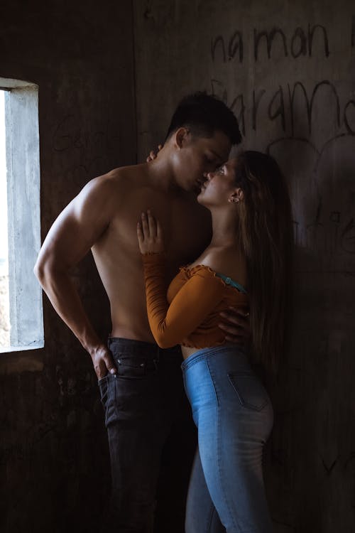 Tender couple kissing in abandoned building