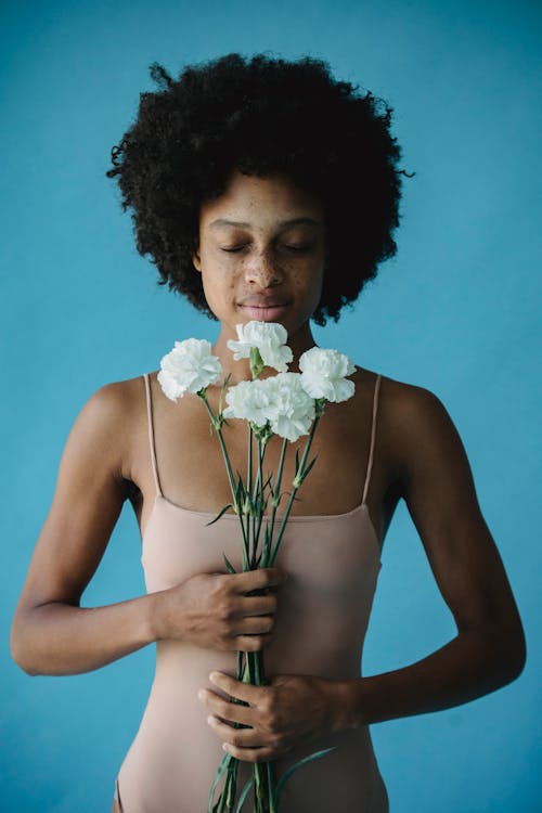 Portrait of a Woman Holding Flowers