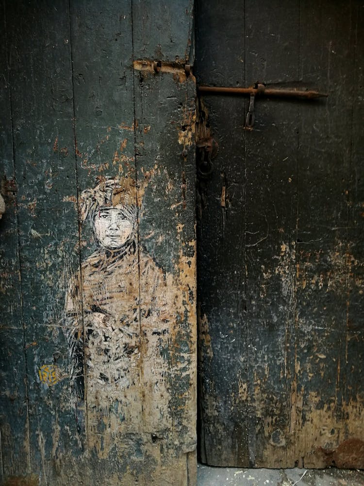 Old Weathered Door With Figurative Drawing