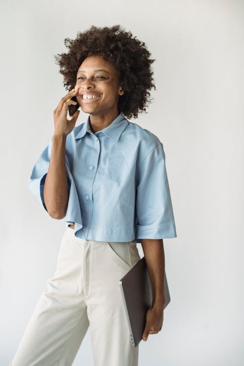 Close up of Woman with Afro Hairstyle Using Phone · Free Stock Photo Close up of Woman with Afro Hairstyle Using Phone · Free Stock Photo