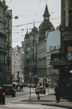 Beautiful street in Riga, Latvia featuring historic architecture and urban bustle.