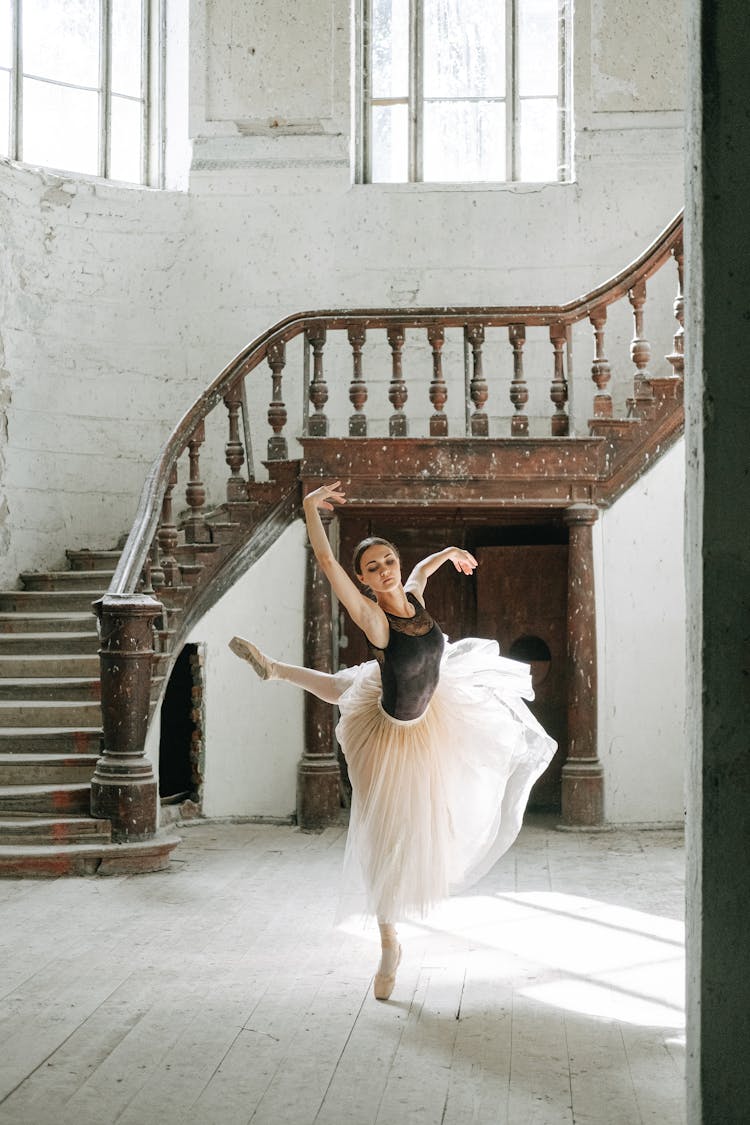 Woman Dancing On Wooden Floor