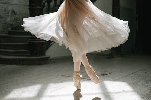 Woman in White Skirt and Ballet Shoes
