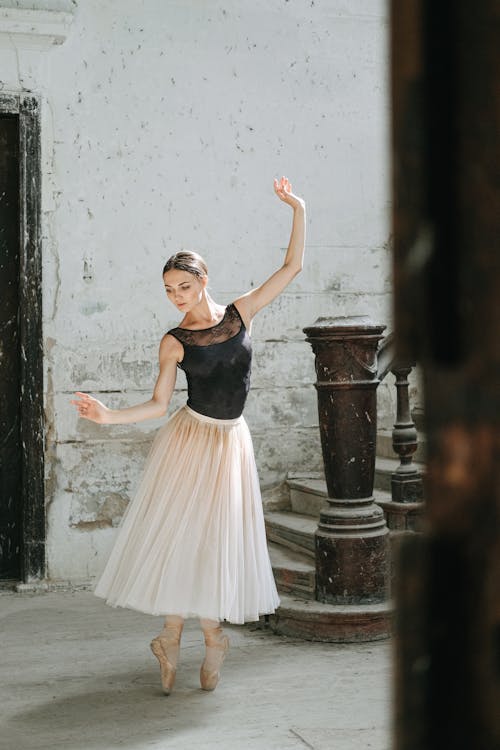 Woman in Black Leotard and Tutu Skirt Dancing