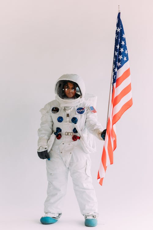Person In A Costume Holding A Flag
