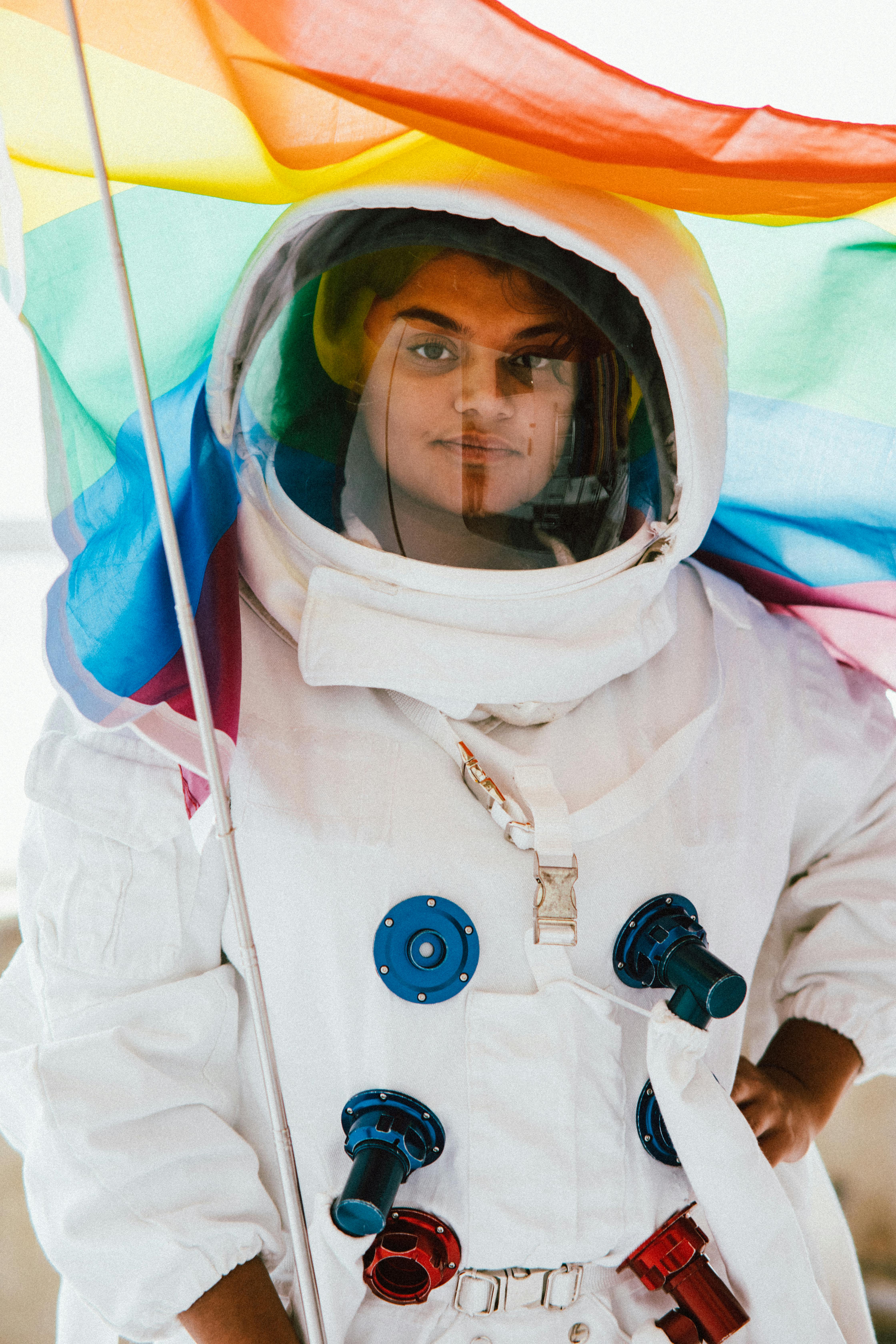 Woman In A Space Suit Holding A Flag