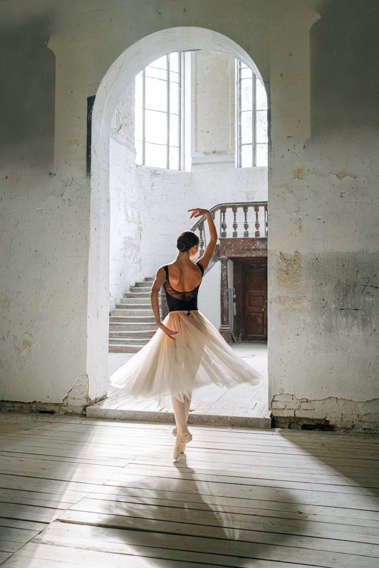 A Back View Of A Woman Dancing Ballet