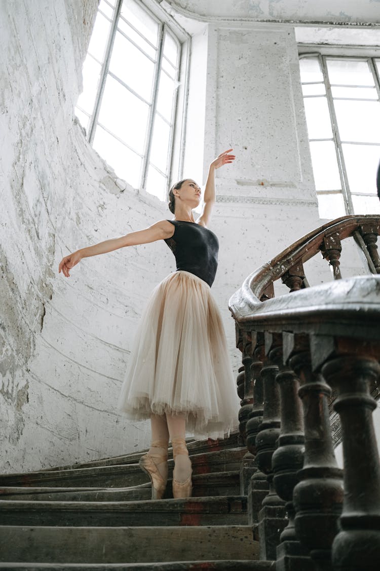 A Woman Dancing On The Stairs 