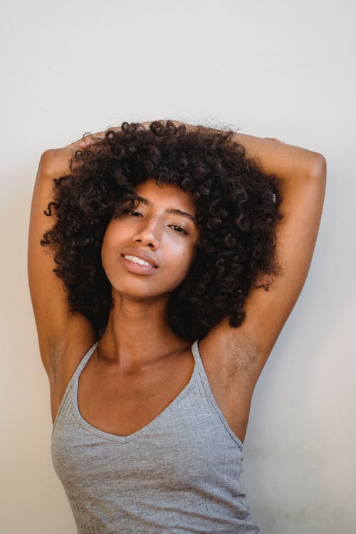 Cheerful black woman looking at camera