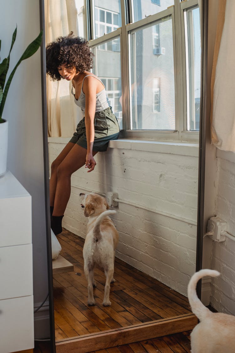 Reflection Of Black Woman With Dog