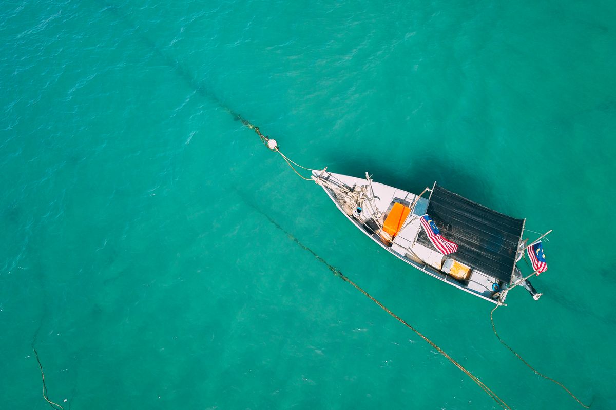 A fishing boat on calm Indonesian reef waters