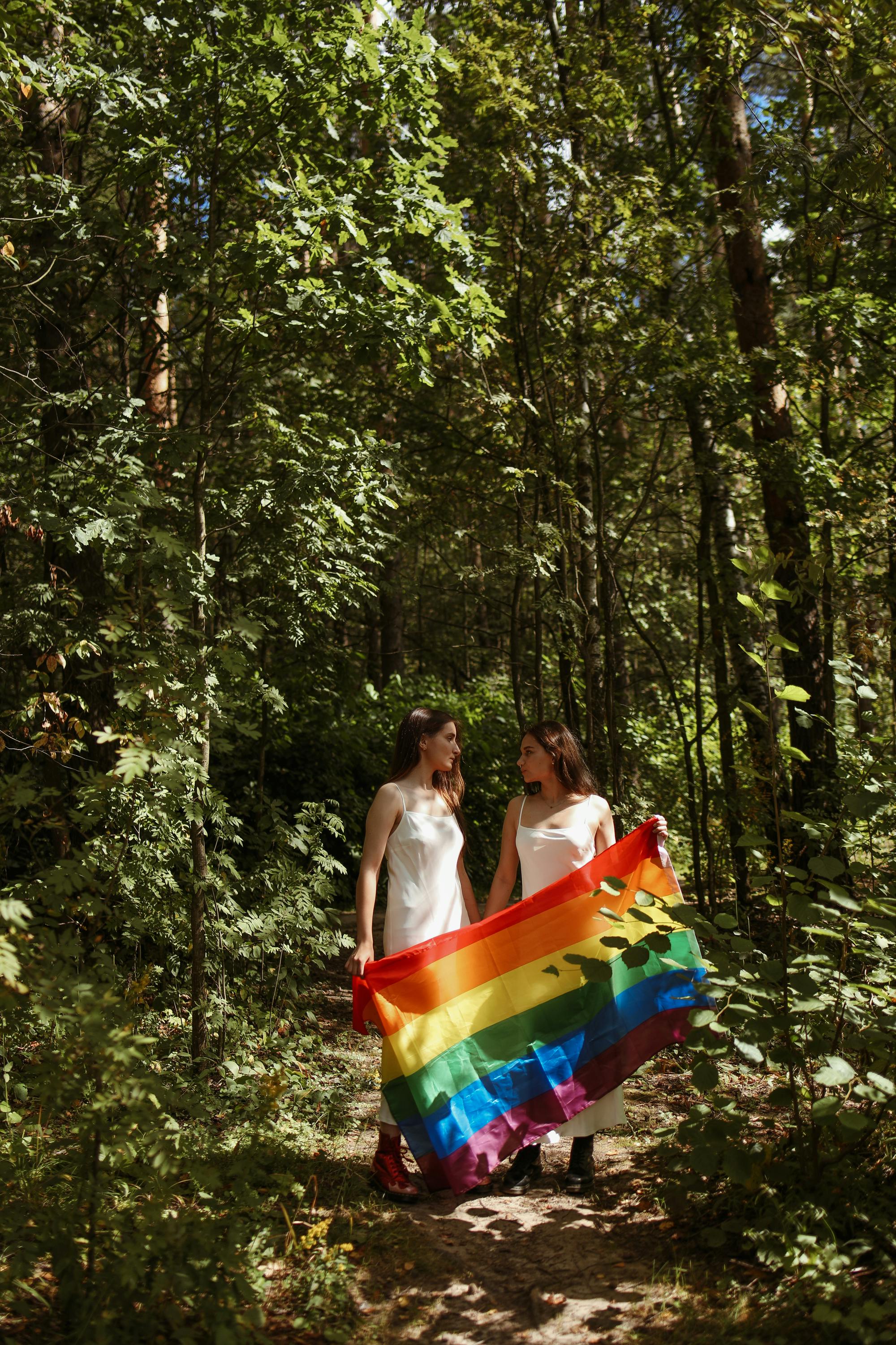 women celebrate love with pride flag