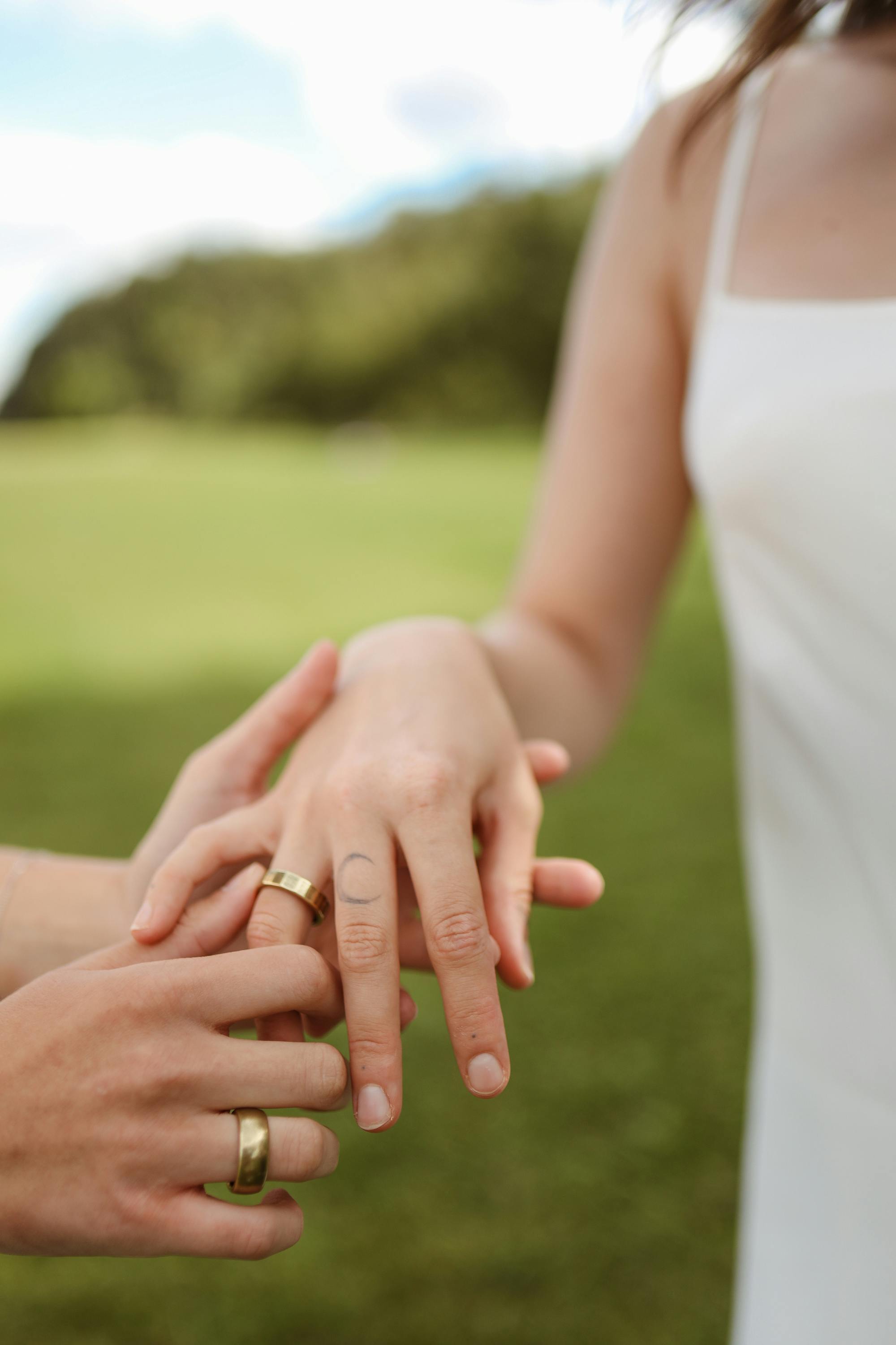 a couple wearing their wedding rings