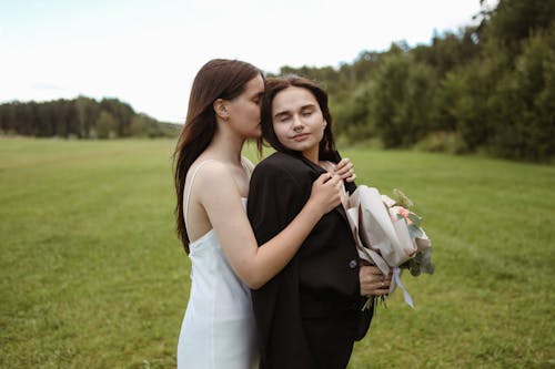 Women with Bouquet Showing Affection 