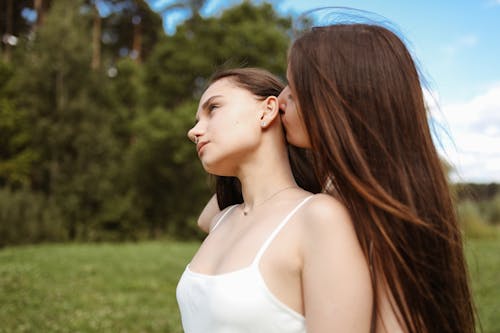 A Woman Kissing another Woman
