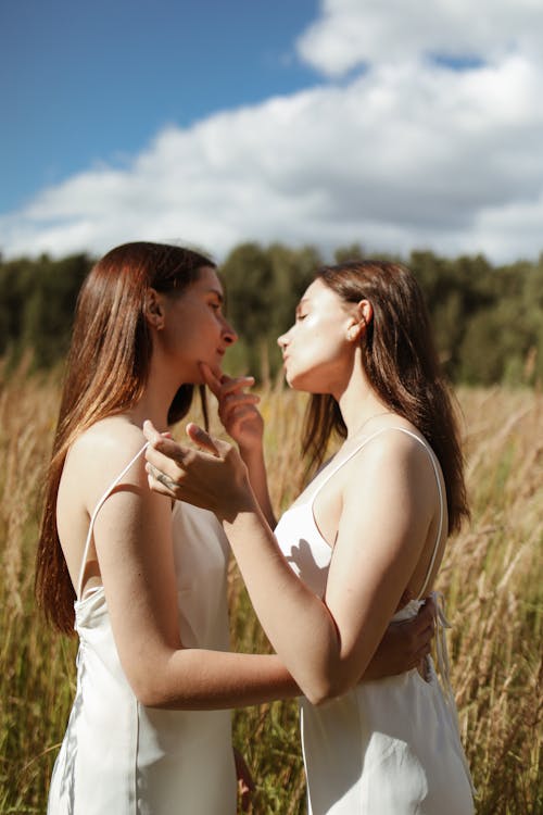 Free Women Showing Affection to Each Other Stock Photo
