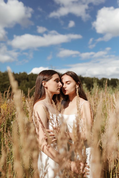 Women Standing in Wheat Field