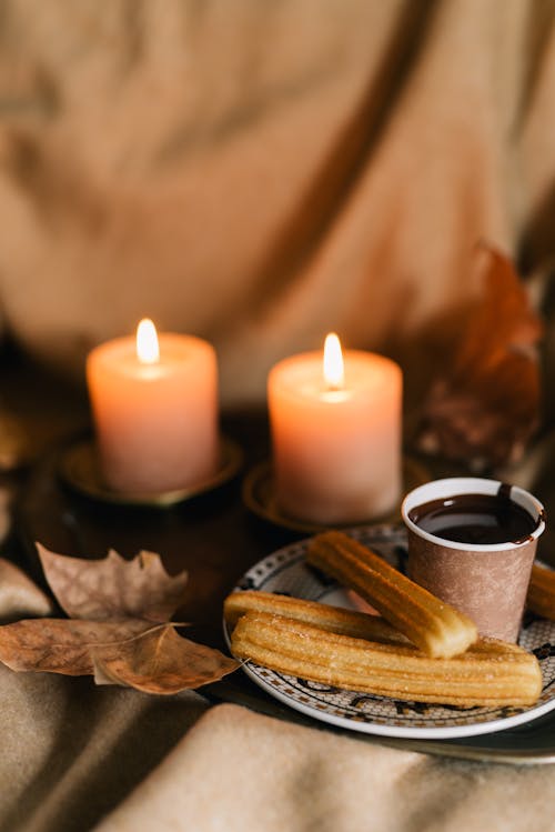 A Churros with Lighted Candles