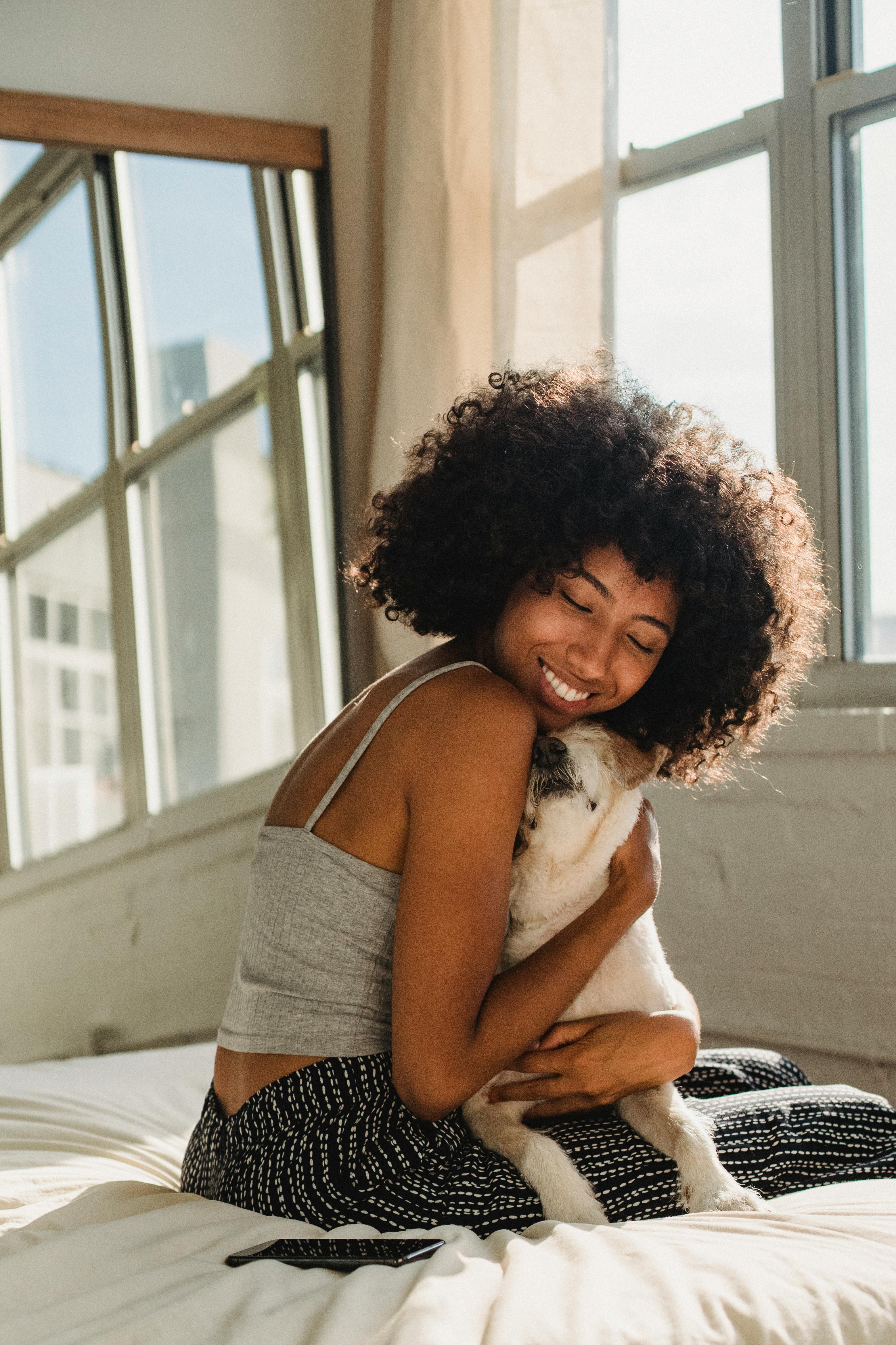 A Woman Hugging the Dog 