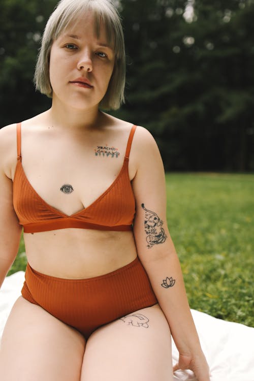 Free Tattooed Woman in Orange Lingerie Stock Photo