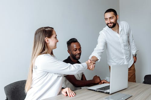 Free A Man and a Woman Shaking Hands Stock Photo