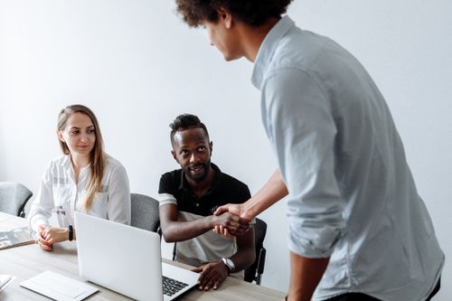 Free A diverse team of colleagues collaborating in an office setting. Stock Photo