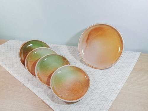 Set of Ceramic Plates on Table